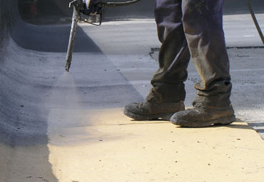 Coating systems over Cleveland spray foam roof systems